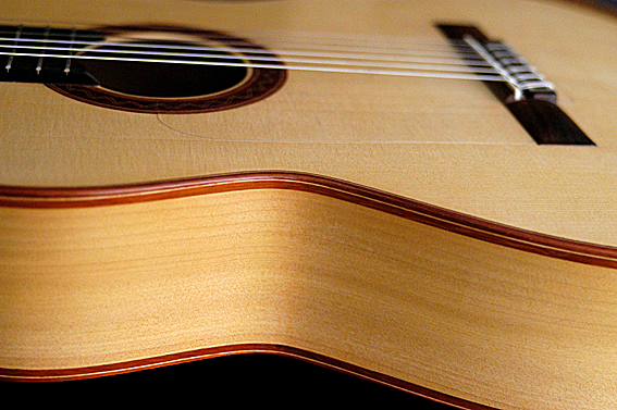 Flamenco guitar shallower neck angle and a lower bridge